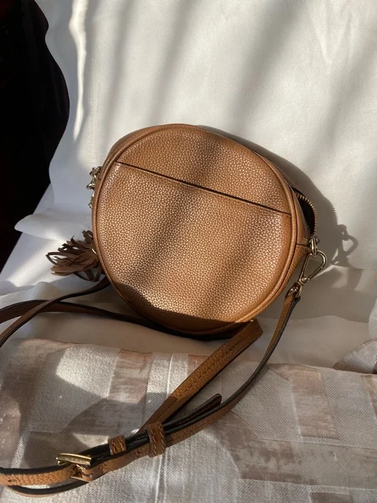 Michael Kors Cognac Pebbled Leather Round Crossbody with Tassel - Picture 3 of 4